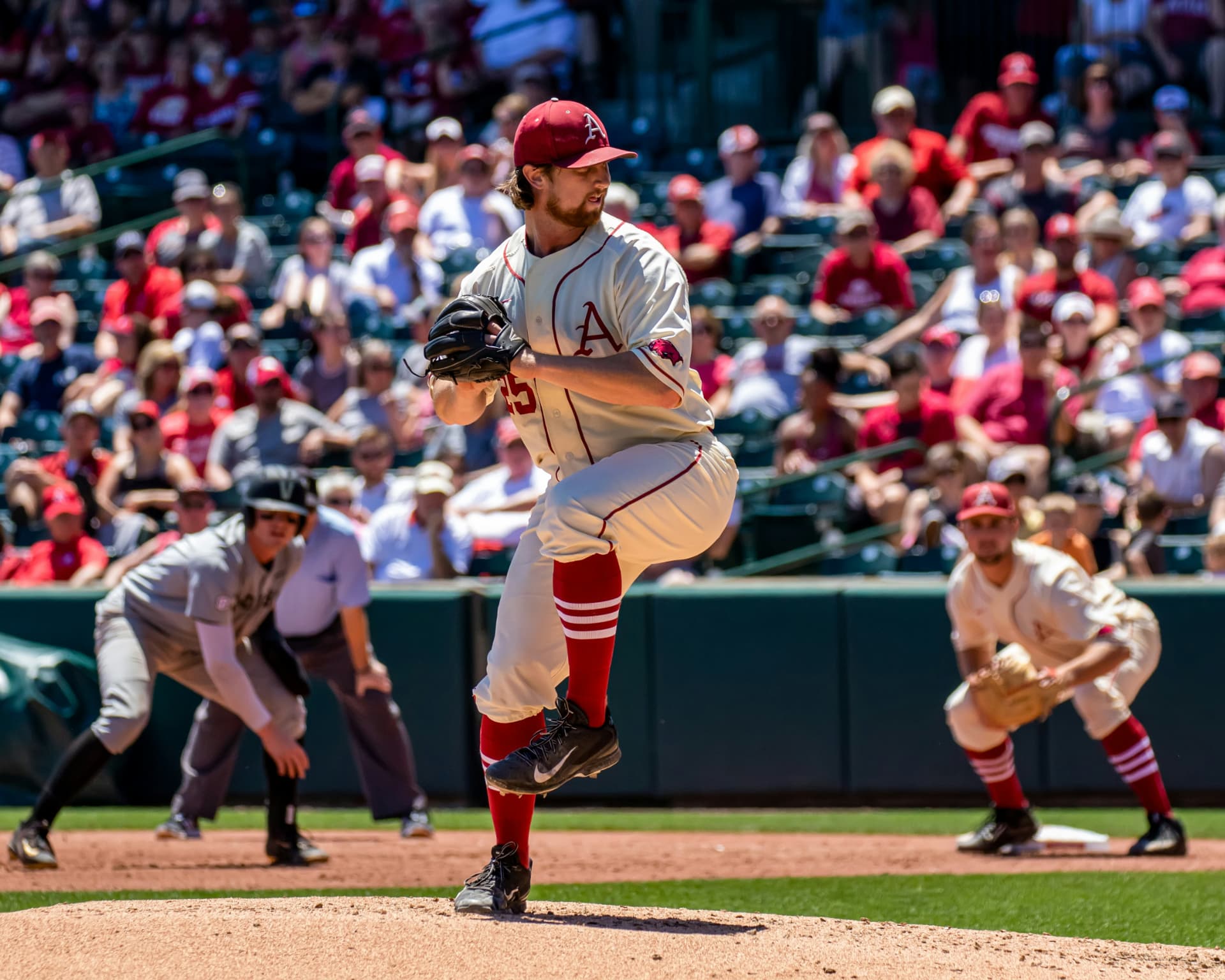Baseball pitcher in a packed stadium